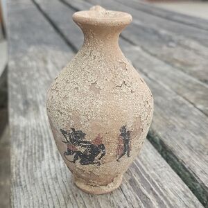 aryballos, which is as small, spherical, or globular flask with A Narrow Neck.